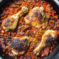 Chicken and chorizo paella in a cast iron skillet