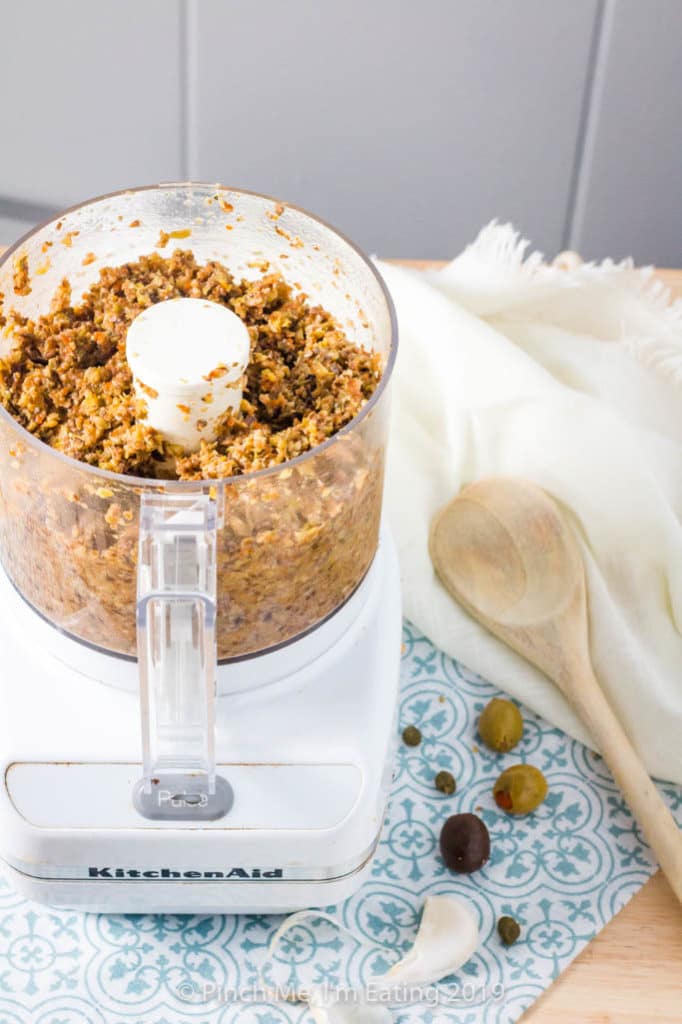 Homemade black and green olive tapenade in a food processor