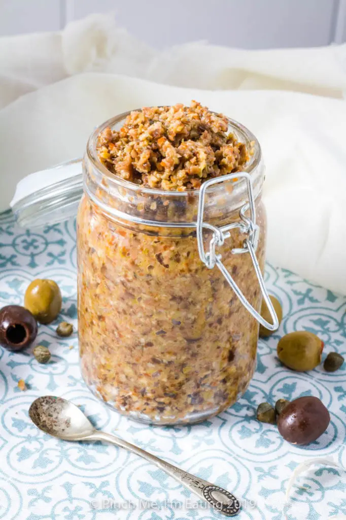 A jar of homemade black and green olive tapenade