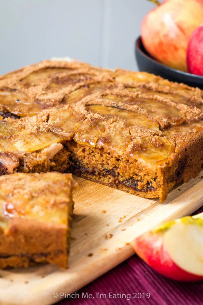 Cinnamon spice apple coffee cake with a piece cut out