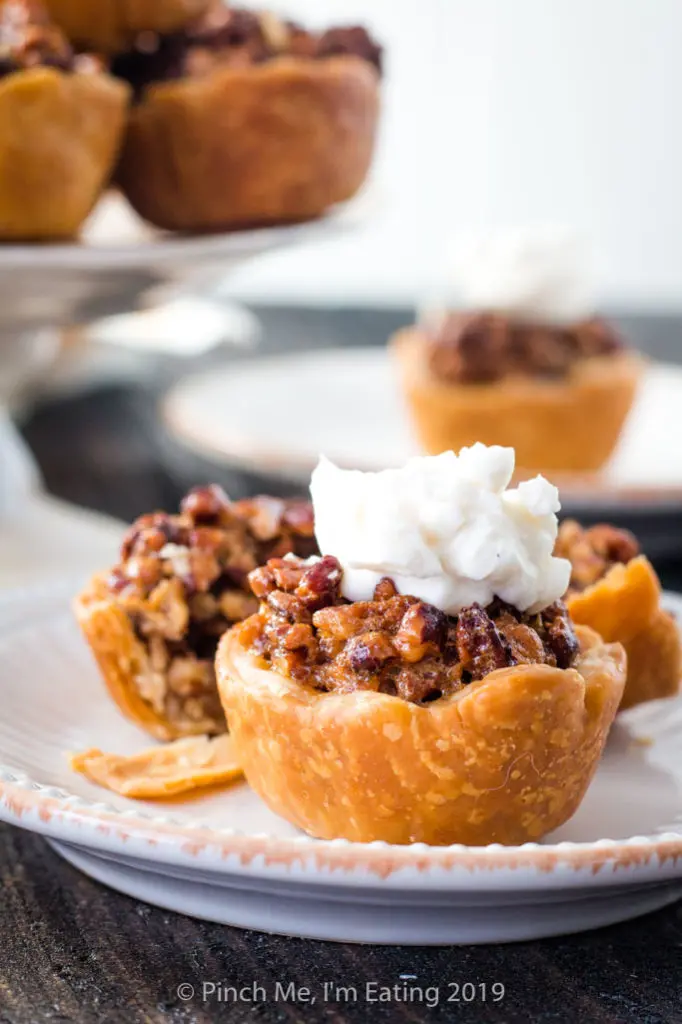 Mini pecan pie with whipped cream