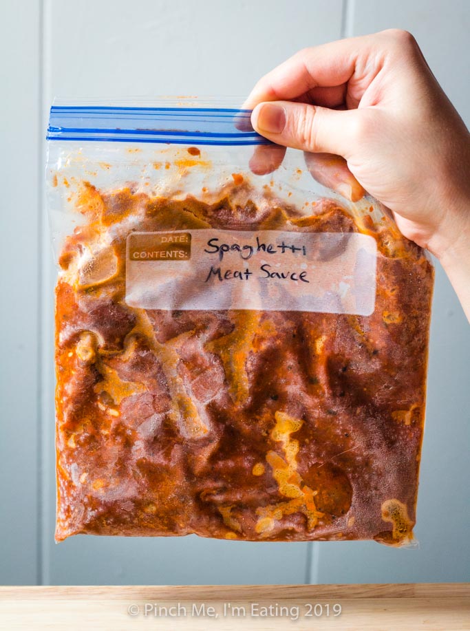 Leftover homemade spaghetti meat sauce frozen flat in a ziplock bag