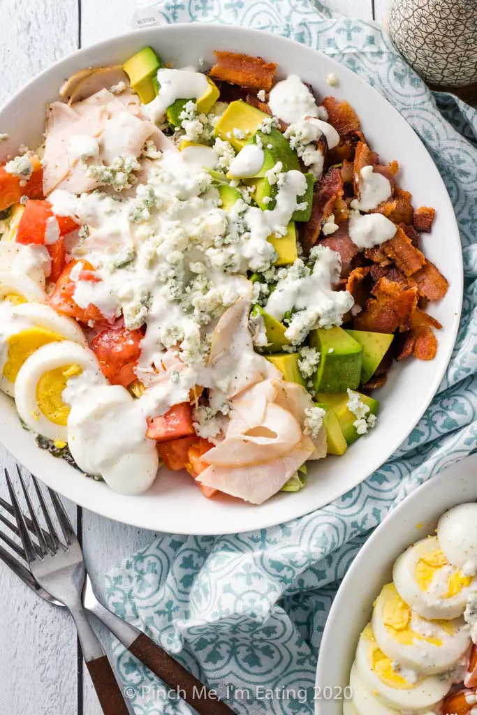 Overhead shot of turkey Cobb salad in a white dish