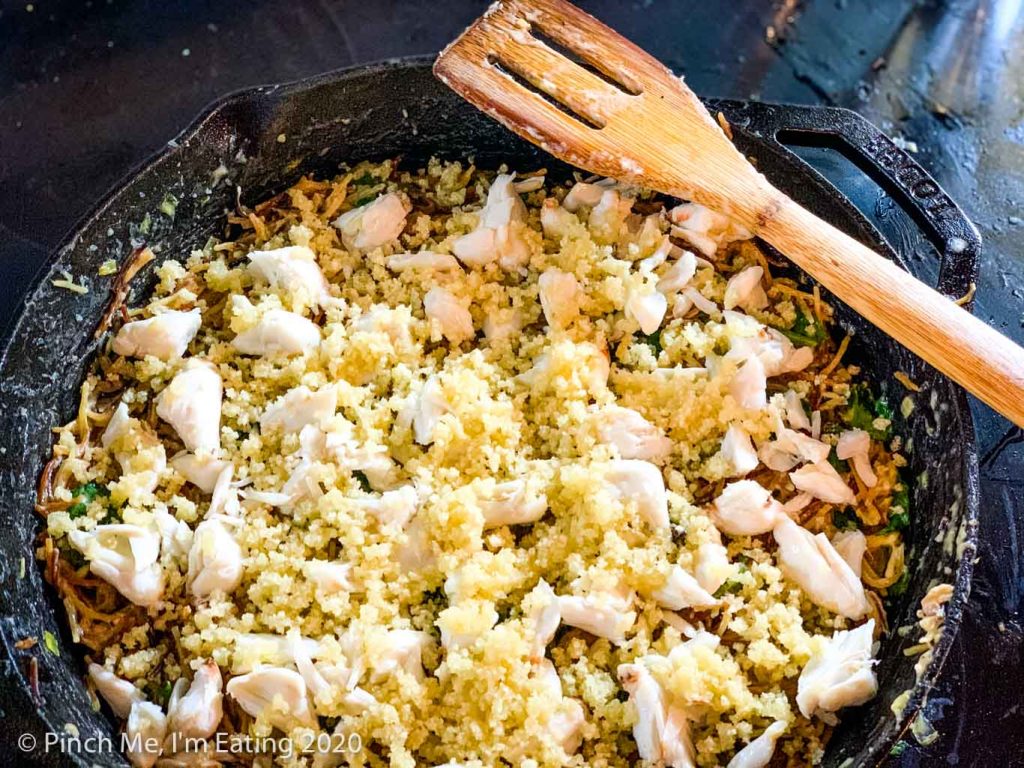 Pasta in cast iron skillet topped with lump crab and bread crumbs