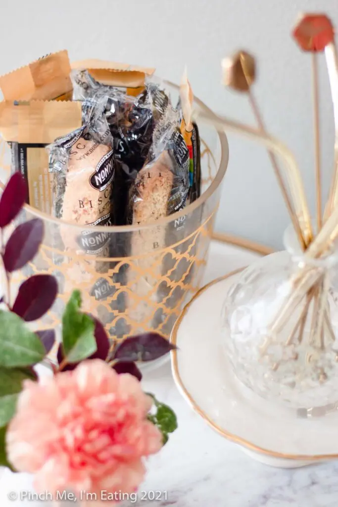 DIY at-home coffee station ideas - coffee bar on dining room buffet with decanted biscotti, snack, and straw display