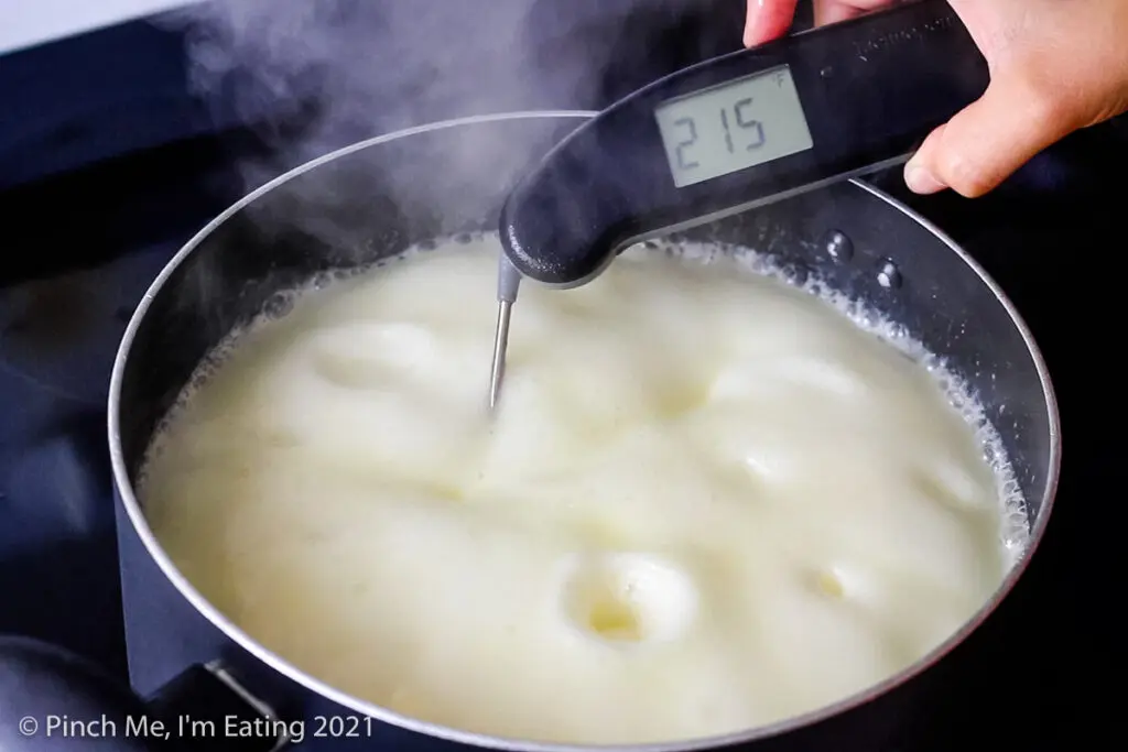 Photo of pecan praline candy mixture at 215 degrees Fahrenheit.