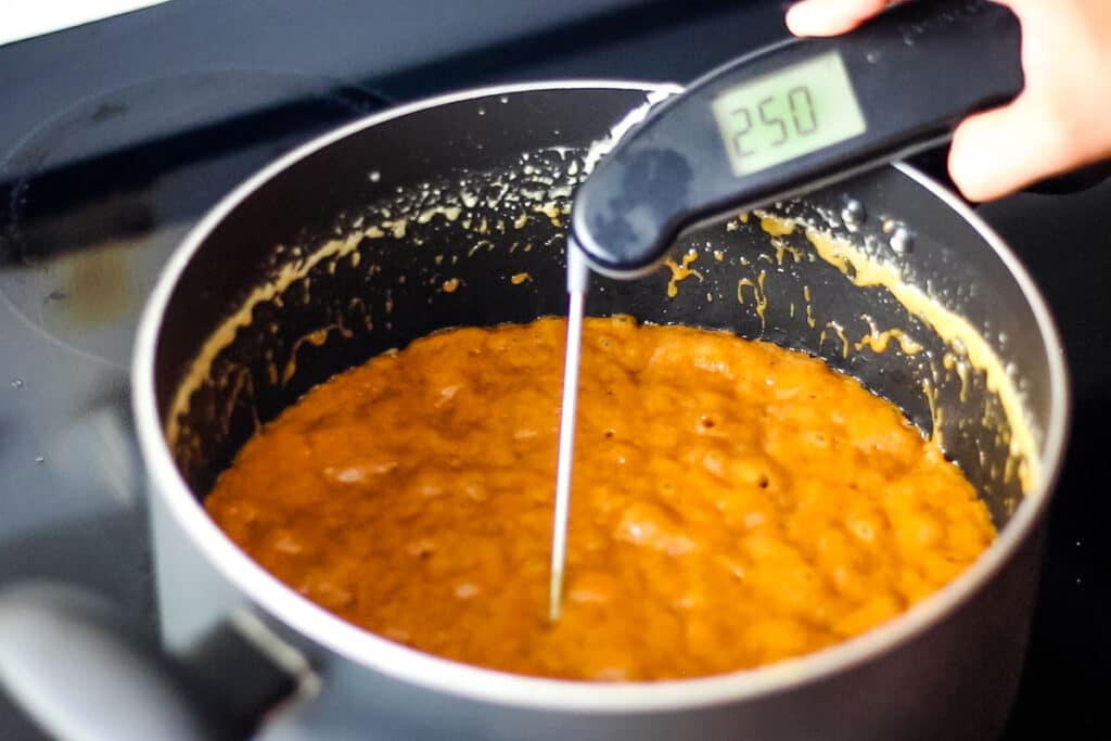 Photo of pecan praline candy mixture at 250 degrees Fahrenheit.