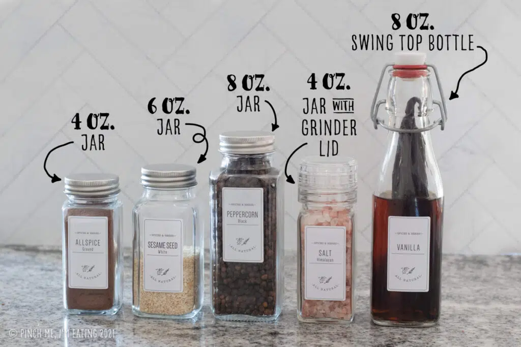 Labeled photo of different sizes of glass spice jars with white labels