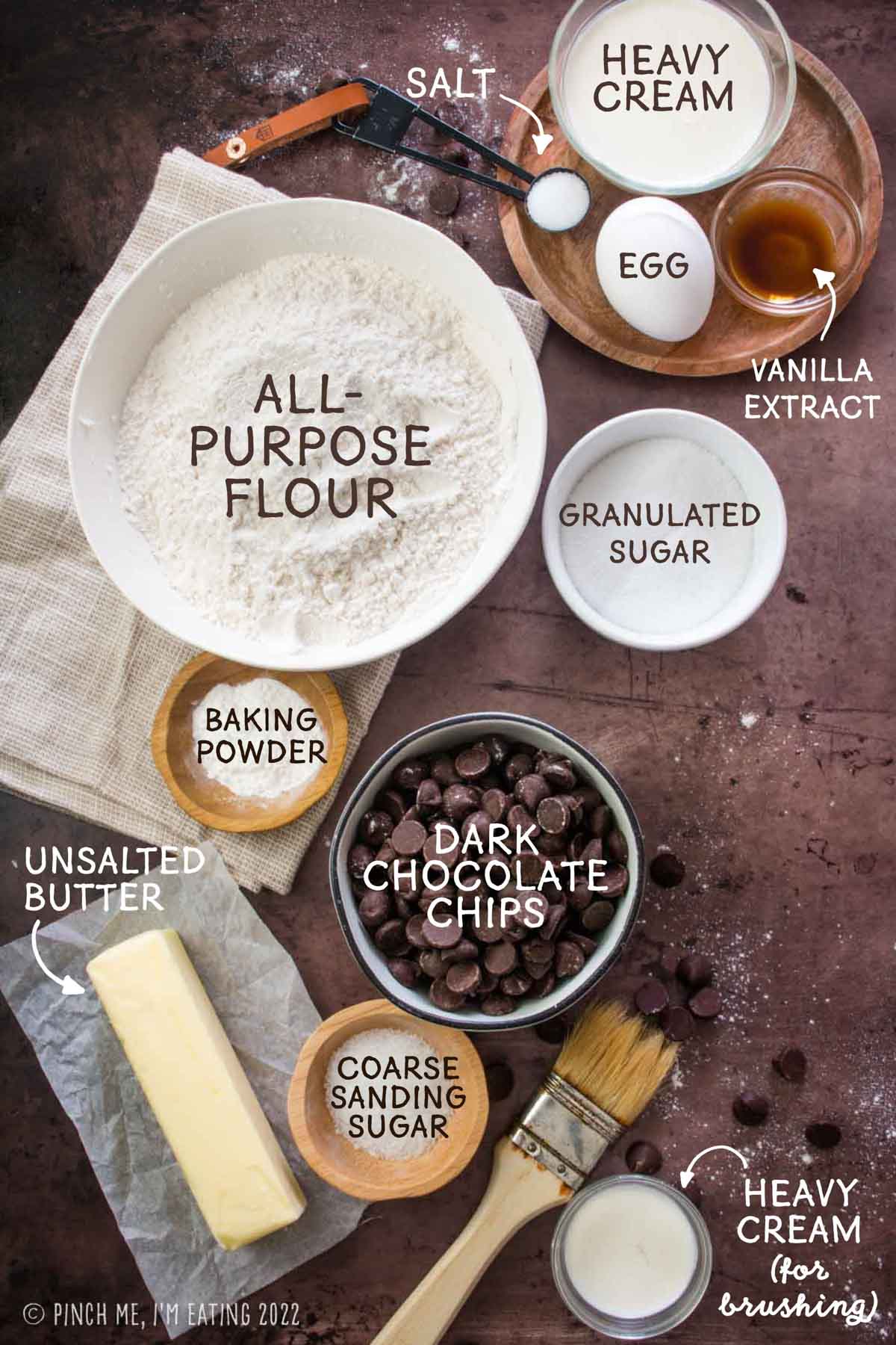 Overhead view of ingredients for easy homemade chocolate chip scones made with butter and heavy cream.