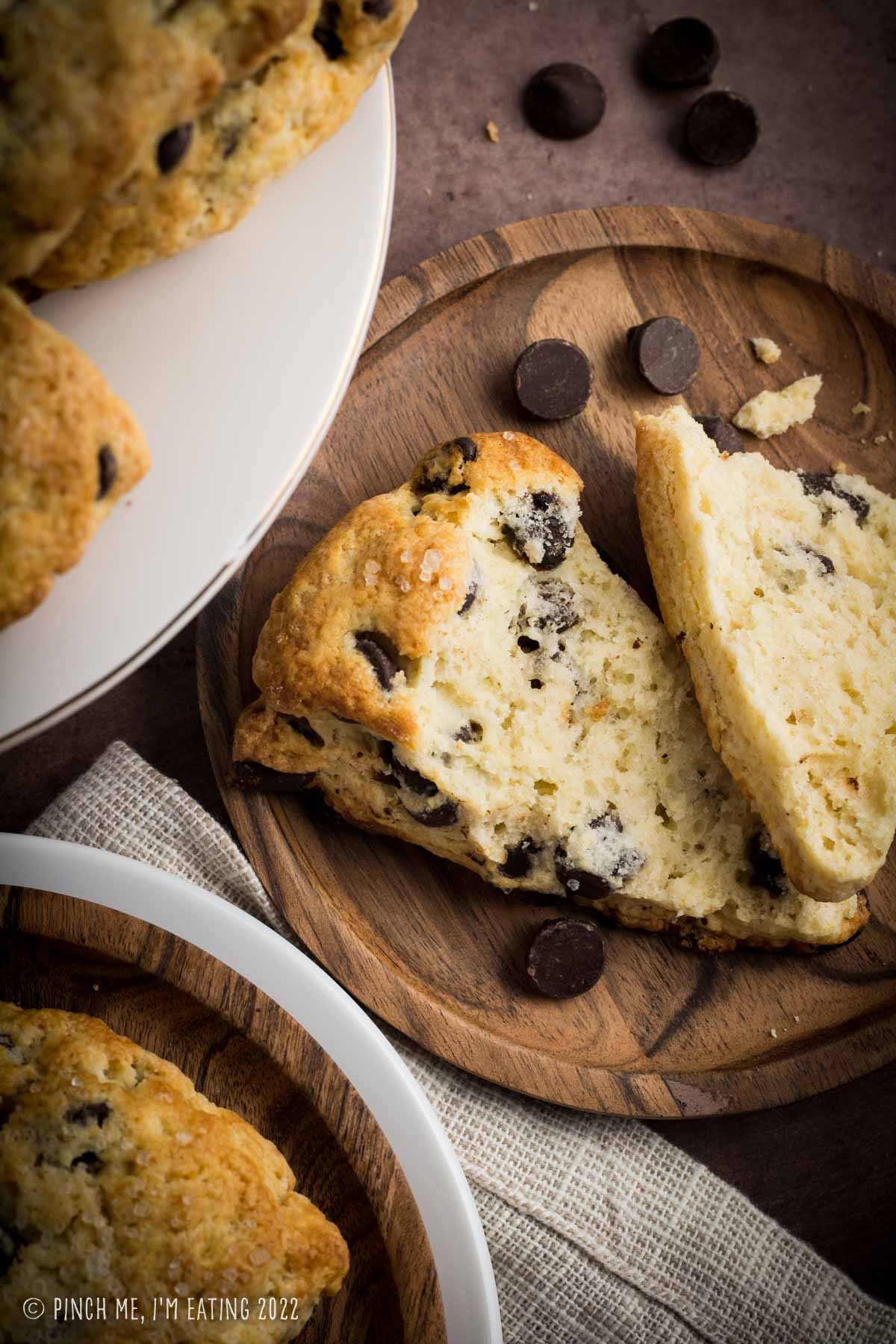 Overhead view showing the inside texture of a flaky homemade dark chocolate chip scone.