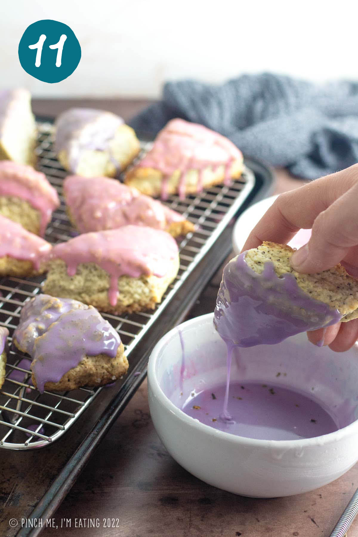 Dipping an Earl Grey scone into lavender glaze.