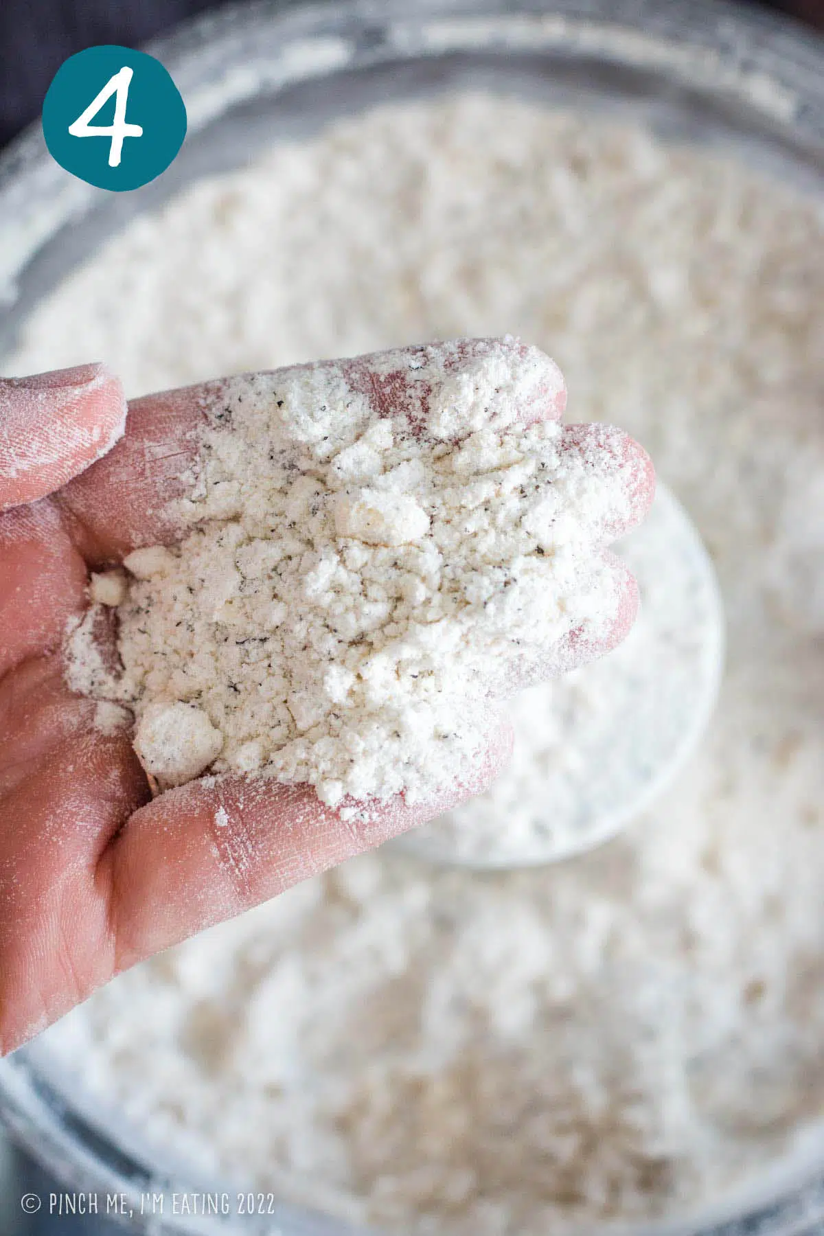 Close up of texture of flour mixture after cutting in cold butter with food processor. 