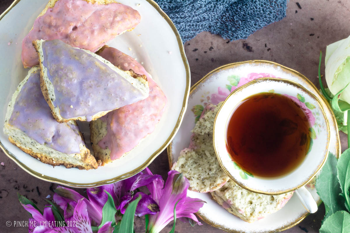 Overhead shot of lavender glazed Earl Grey scones and cup of tea.