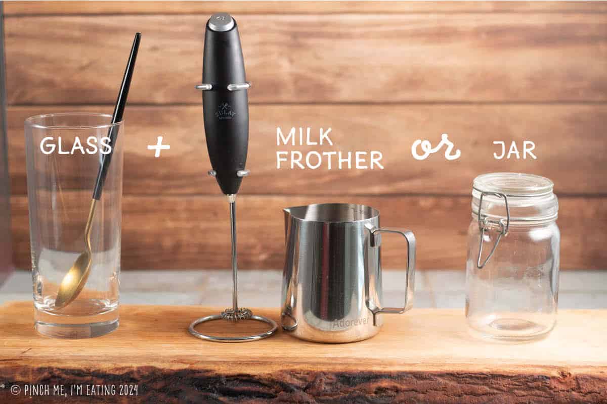 Equipment needed to make lavender sweet cream cold foam matcha latte: glass and spoon plus either a handheld milk frother or jar with lid.