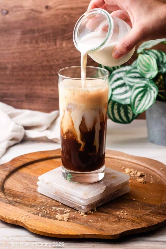 An iced brown sugar oatmilk shaken espresso in a glass.