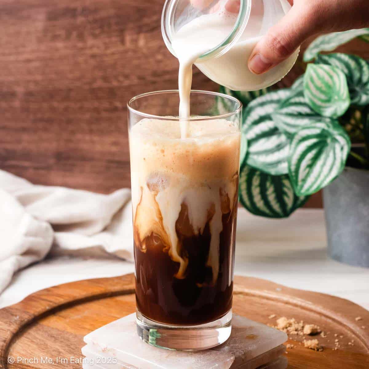An iced coffee drink in a glass.