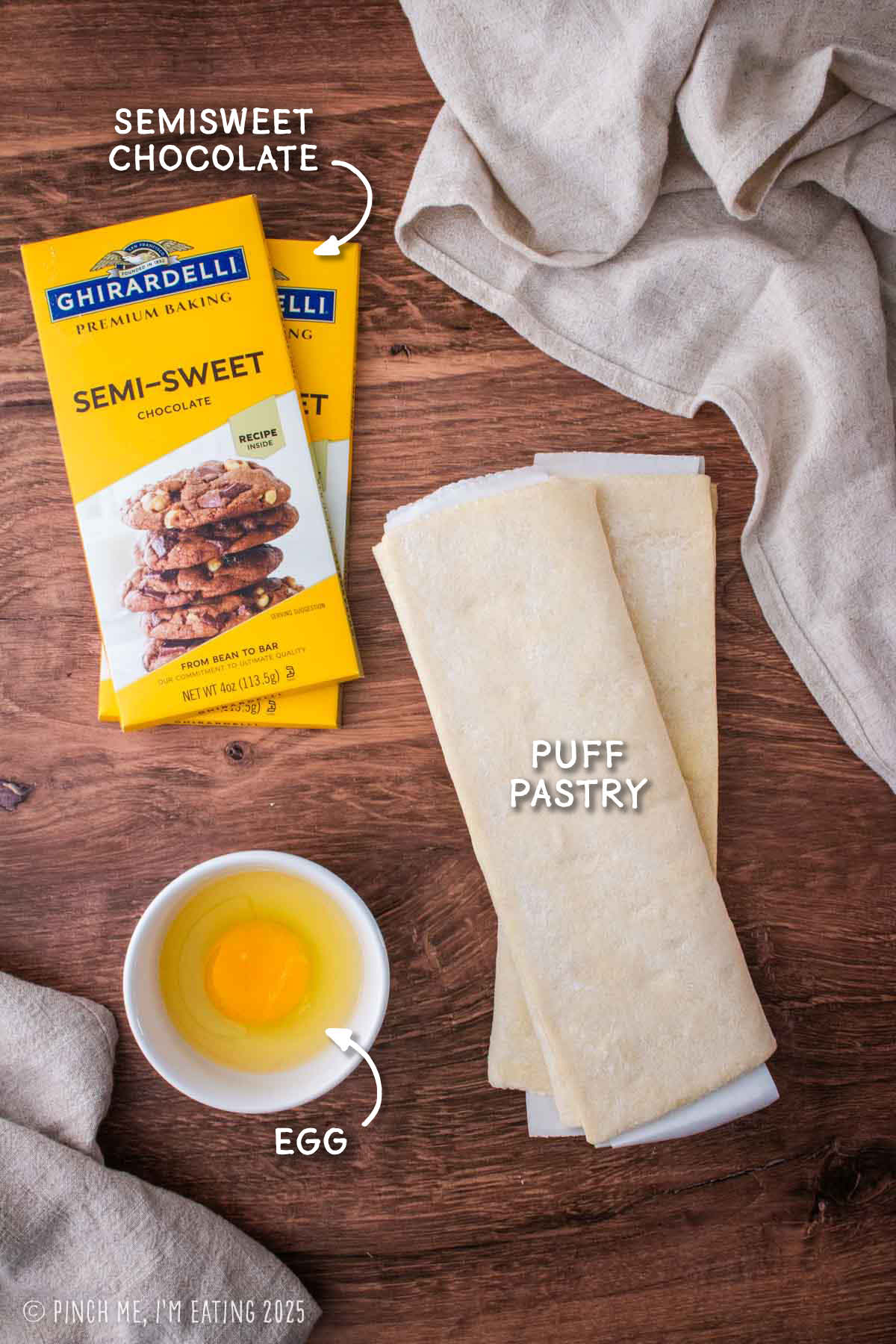 Labeled ingredient shot including semisweet baking chocolate, puff pastry, and an egg.