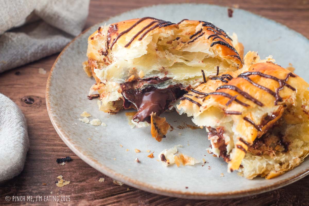 Melted chocolate coming out of a homemade croissant.