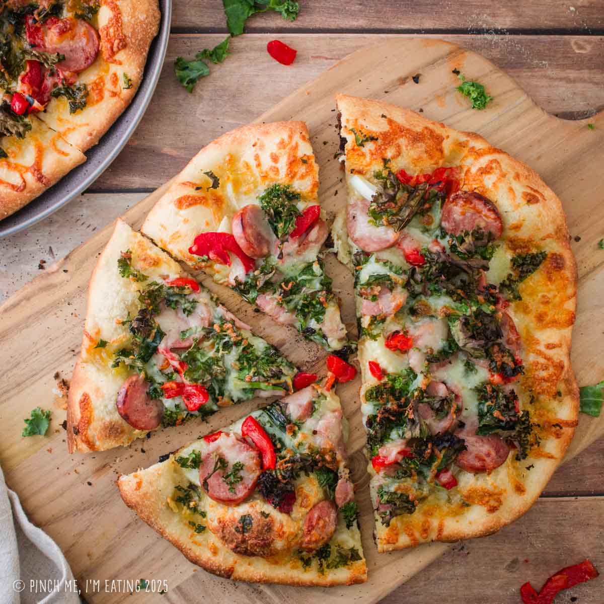 Pizza with chicken apple sausage, fennel, and kale.