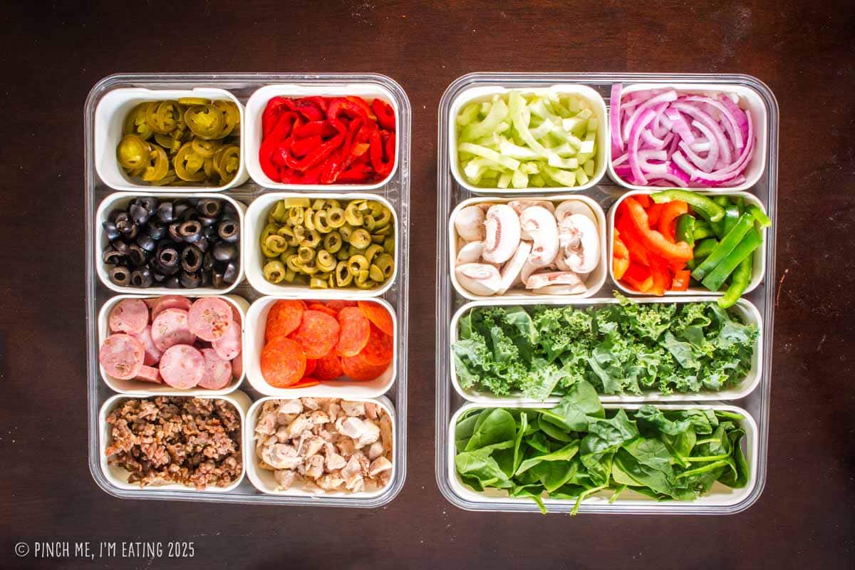 Prepared pizza toppings in divided food storage containers.