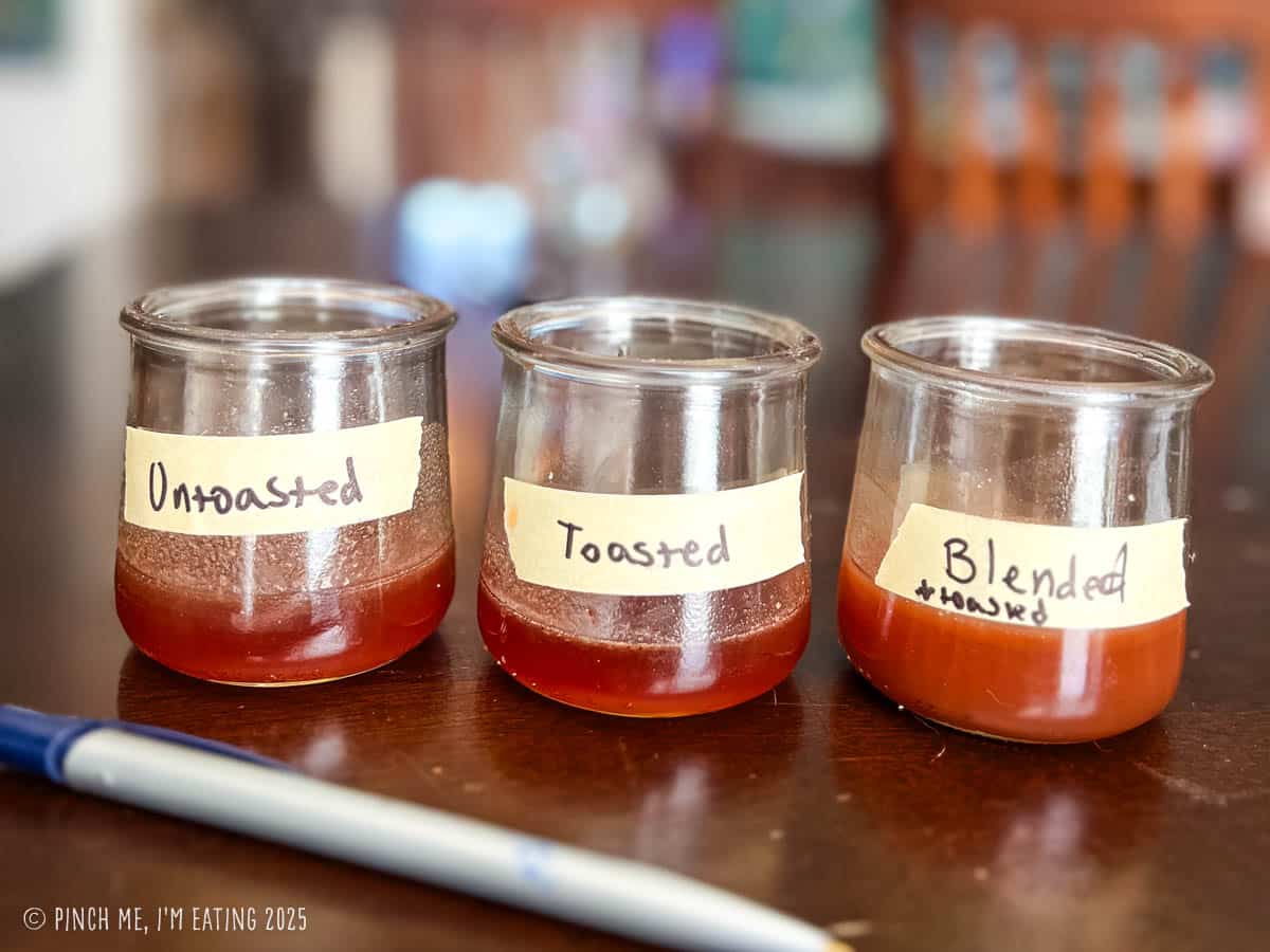 Small batches of three different techniques of pecan syrup in small jars.
