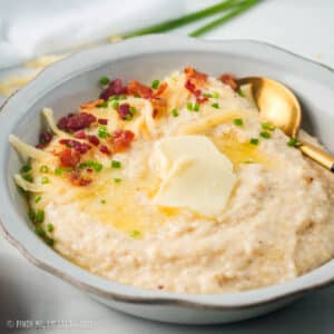 Smoked gouda grits in a white bowl.